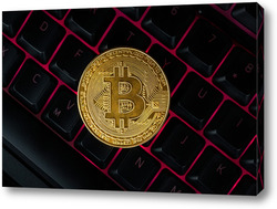    Gold bitcoin on the keyboard.